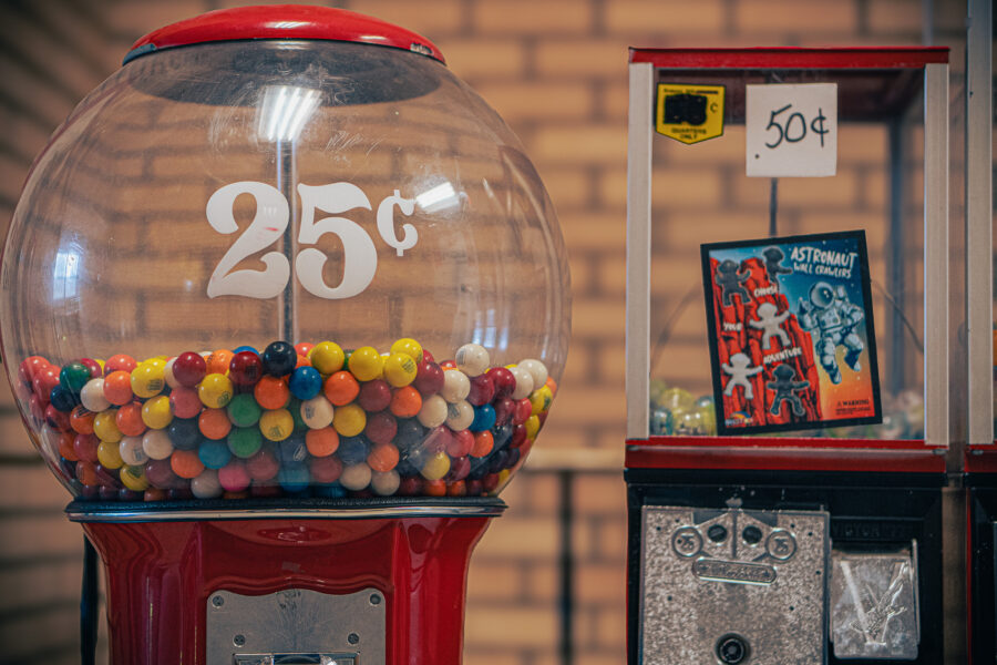Vintage gumball machine priced at 25 cents and toy vending machine priced at 50 cents Gleecloff's Haliburton Ontario.