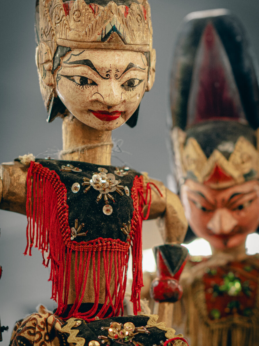 Handcrafted wooden puppets with painted faces and ornate costumes at Castle Antiques Haliburton Ontario.