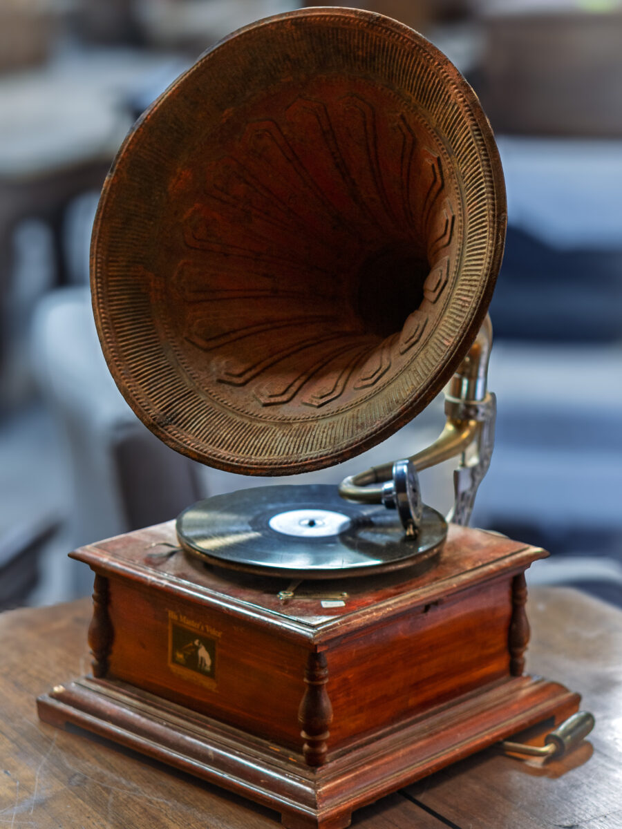 Early phonograph record player with large horn and wooden base at Castle Antiques Haliburton Ontario.