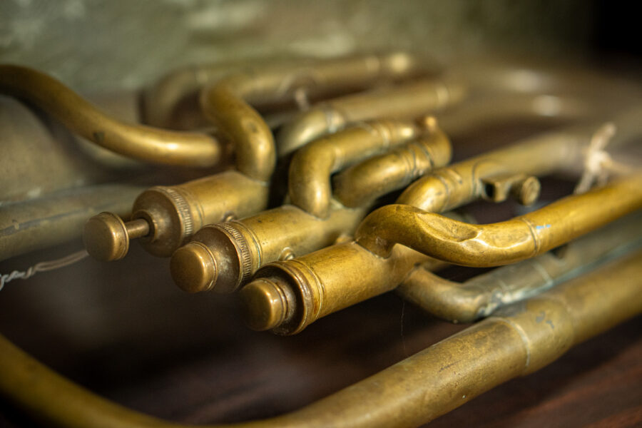 Antique brass trumpet showing valves and tubing at Castle Antiques Haliburton Ontario.