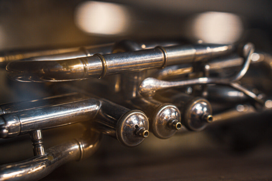 Vintage silver trumpet with polished finish and valve details at Castle Antiques Haliburton Ontario.