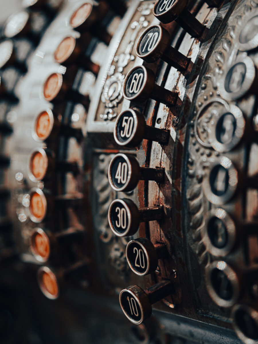 Detailed shot of ornate vintage cash register buttons at Haliburton Ontario.