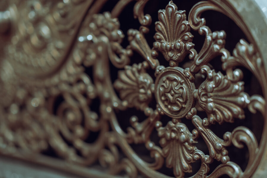 Intricate antique brass floral and scrollwork design plate at Castle Antiques Haliburton Ontario.