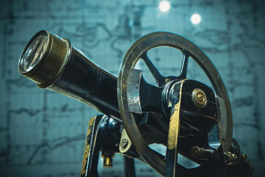Vintage brass and iron surveyor’s transit instrument used for land mapping at Haliburton Ontario Museum.