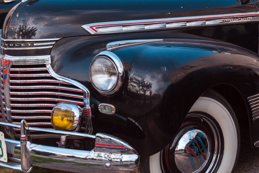 Close-up of a black vintage Chevrolet Special Deluxe car with chrome details, Minden Ontario