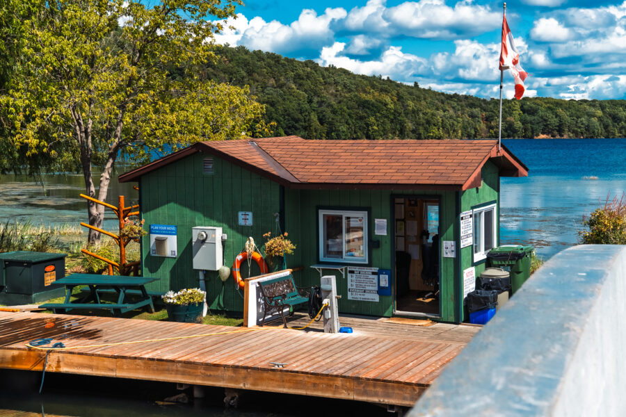 Westport Ontario marina dock house with Canadian flag on Rideau Lake
