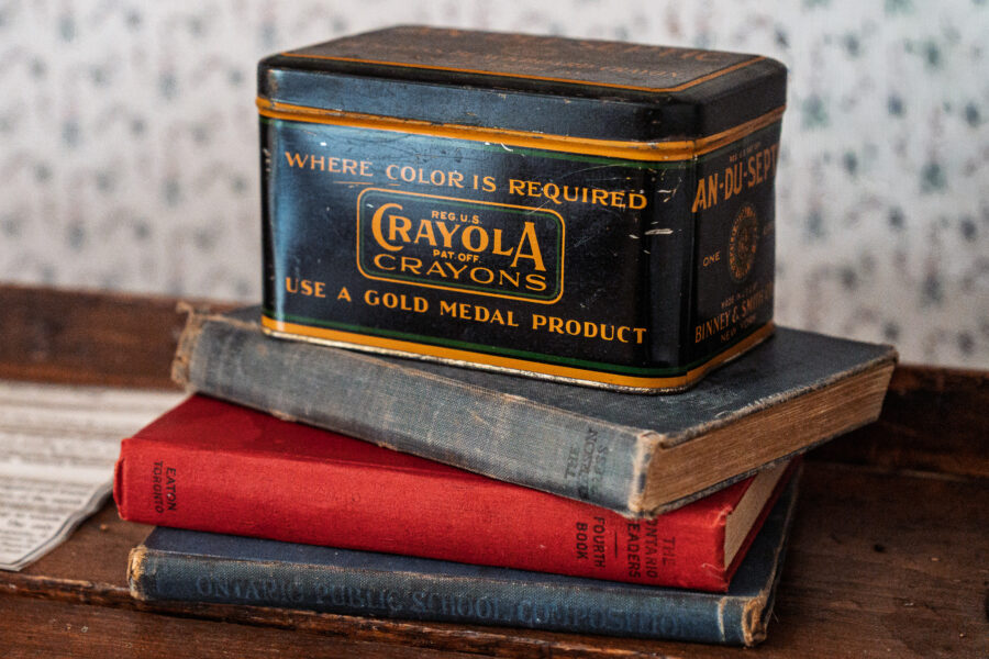 Vintage Crayola tin and old Ontario schoolbooks on display in Westport museum