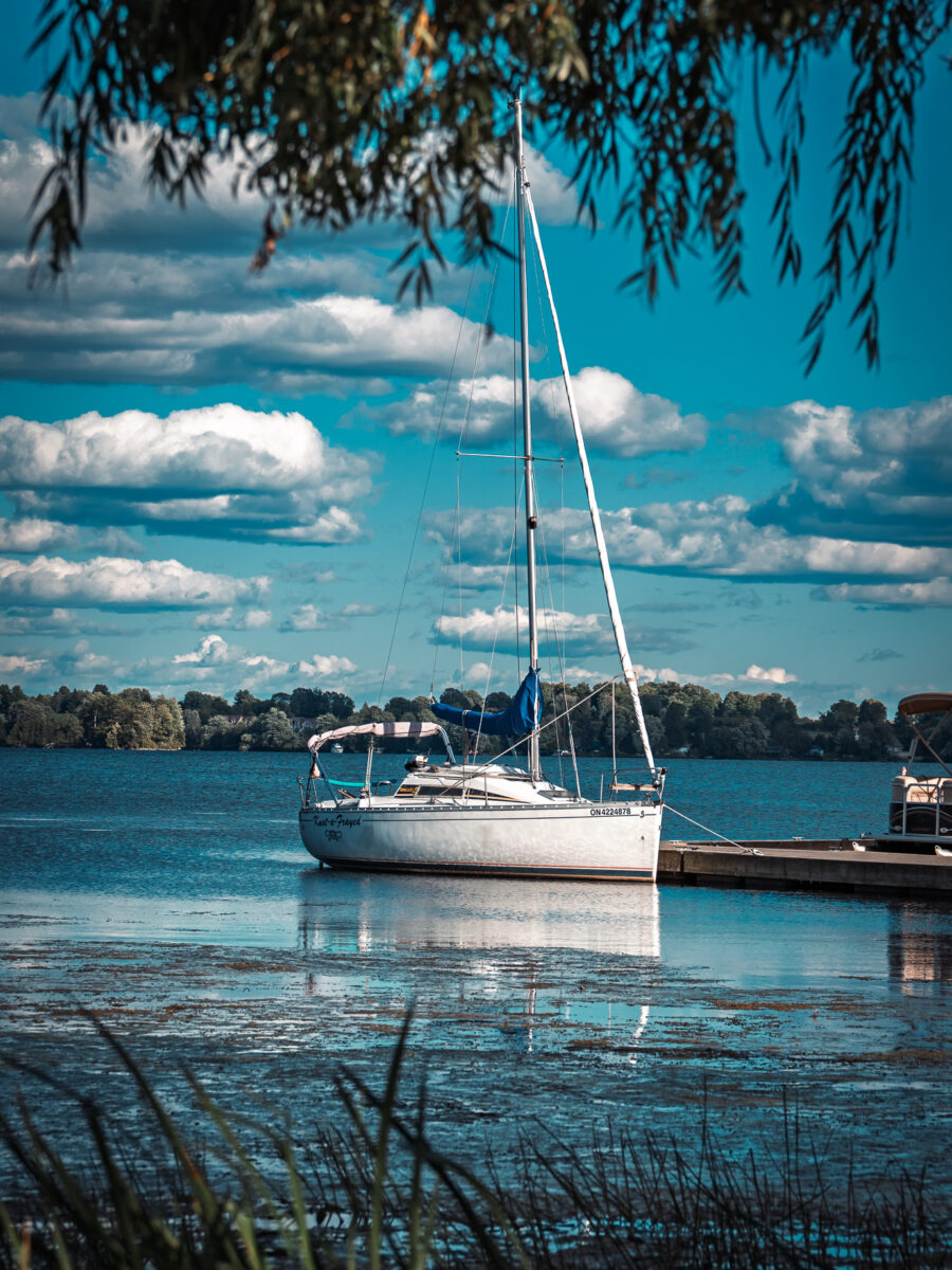 Sailboat docked at marina on Rideau Lake in Westport Ontario